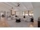Bright living room with a large white sectional, high ceilings, and access to the outdoor patio at 9208 N 83Rd St, Scottsdale, AZ 85258