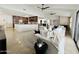 Open-concept living room with modern furnishings, kitchen access, and natural light at 9208 N 83Rd St, Scottsdale, AZ 85258