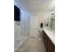 Bathroom featuring glass enclosed shower, dual sink vanity, and modern finishes at 9807 W Mcrae Way, Peoria, AZ 85382