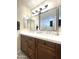 Elegant bathroom with double vanity, quartz countertop and contemporary lighting fixtures at 9807 W Mcrae Way, Peoria, AZ 85382