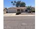 Charming home with tile roof and well-manicured desert landscaping at 9807 W Mcrae Way, Peoria, AZ 85382