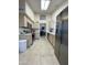 Bright kitchen with stainless steel appliances and tiled floors at 9807 W Mcrae Way, Peoria, AZ 85382