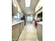 Bright kitchen with stainless steel appliances and skylight at 9807 W Mcrae Way, Peoria, AZ 85382