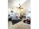 Spacious living room featuring tiled floors, vaulted ceiling, and a ceiling fan at 9807 W Mcrae Way, Peoria, AZ 85382