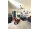Living room with vaulted ceiling, tiled floors, and neutral decor at 9807 W Mcrae Way, Peoria, AZ 85382