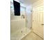 Modern shower with a frameless glass door and mosaic tile accents in the bathroom at 9807 W Mcrae Way, Peoria, AZ 85382