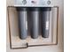 Water filtration system with copper piping installed against a light-colored wall at 9807 W Mcrae Way, Peoria, AZ 85382