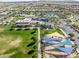 Aerial view showcasing the neighborhood playground, large fields, and recreation area at 10034 E Thunderbolt Ave, Mesa, AZ 85212