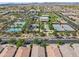 Community aerial showcasing lush landscaping, amenity center, and well-maintained tennis courts at 10034 E Thunderbolt Ave, Mesa, AZ 85212