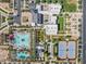 Aerial view of resort-style community amenities including pools, tennis courts, and clubhouse at 10034 E Thunderbolt Ave, Mesa, AZ 85212