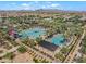 Aerial view of community pool, water slides, and meticulously kept grounds at 10034 E Thunderbolt Ave, Mesa, AZ 85212