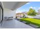 A cozy backyard with a manicured lawn, patio seating, and a charming gazebo at 10034 E Thunderbolt Ave, Mesa, AZ 85212