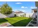 A manicured backyard featuring a lush lawn, providing a perfect outdoor space at 10034 E Thunderbolt Ave, Mesa, AZ 85212
