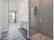 Modern bathroom featuring a glass-enclosed shower, sleek vanity, and stylish gray patterned tile at 10034 E Thunderbolt Ave, Mesa, AZ 85212