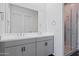 Modern bathroom with a double sink vanity, sleek countertops, and a glass-enclosed shower for a spa-like experience at 10034 E Thunderbolt Ave, Mesa, AZ 85212
