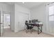 This bedroom includes an office space, walk-in closet, and a nice neutral toned carpet at 10034 E Thunderbolt Ave, Mesa, AZ 85212