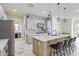 Stylish kitchen with gray cabinets, stainless steel appliances, and a large island with bar seating at 10034 E Thunderbolt Ave, Mesa, AZ 85212
