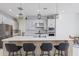 Beautiful kitchen with a large island, modern lighting, and sleek stainless steel appliances at 10034 E Thunderbolt Ave, Mesa, AZ 85212