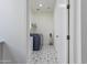 Convenient laundry room featuring modern washer and dryer with stylish decorative tiled floor and ample space at 10034 E Thunderbolt Ave, Mesa, AZ 85212
