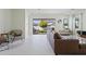 Bright and airy living room featuring modern furnishings and a seamless indoor-outdoor living experience at 10034 E Thunderbolt Ave, Mesa, AZ 85212