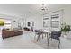 Bright living room with large windows, stylish furnishings, and an open layout for comfortable living at 10034 E Thunderbolt Ave, Mesa, AZ 85212