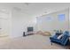Spacious living room with neutral carpet, and a cozy blue sofa at 10034 E Thunderbolt Ave, Mesa, AZ 85212