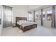 Serene bedroom featuring a king-size bed, soft lighting, and large windows offering natural light at 10034 E Thunderbolt Ave, Mesa, AZ 85212
