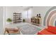 A cozy playroom with a colorful rainbow mural, shelving, and playful decor creates an inviting space at 10034 E Thunderbolt Ave, Mesa, AZ 85212