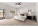 Spacious bedroom with neutral tones, plush carpet, and ample natural light at 1018 E Knoll St, Mesa, AZ 85203