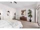 Bright bedroom with neutral tones, carpet, and sliding glass door at 1018 E Knoll St, Mesa, AZ 85203