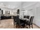 Modern dining area with a stylish table, chairs, and lighting fixture at 1018 E Knoll St, Mesa, AZ 85203
