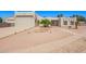 Stylish home with desert landscaping, a two-car garage, and a neutral color palette at 1018 E Knoll St, Mesa, AZ 85203