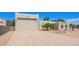 Stylish home with a large driveway, a two-car garage, and desert landscaping at 1018 E Knoll St, Mesa, AZ 85203