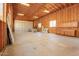 Spacious garage with high ceilings, overhead lighting, and cabinet storage at 1018 E Knoll St, Mesa, AZ 85203