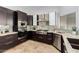 Sleek kitchen featuring stainless steel appliances, dark cabinets, and granite countertops at 1018 E Knoll St, Mesa, AZ 85203