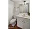 A well lit and updated bathroom features a white vanity and standard toilet at 1095 W Sandy Banks --, Gilbert, AZ 85233