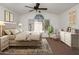 Bedroom features neutral colors, carpet, ceiling fan, and a large window at 1095 W Sandy Banks --, Gilbert, AZ 85233