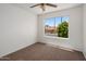 Bedroom with neutral carpet, ceiling fan and natural light from the window at 1095 W Sandy Banks --, Gilbert, AZ 85233