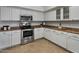 Kitchen features stainless steel appliances, white cabinetry, and neutral countertops at 1095 W Sandy Banks --, Gilbert, AZ 85233
