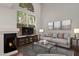 Cozy living room features a fireplace, large windows, and comfortable seating at 1095 W Sandy Banks --, Gilbert, AZ 85233