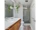 Bright bathroom featuring modern fixtures, white tile walls, and a stylish glass-enclosed shower at 110 W Missouri Ave # 18, Phoenix, AZ 85013