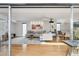 Open-concept living area with modern furniture, light hardwood floors, and a dining space at 110 W Missouri Ave # 18, Phoenix, AZ 85013