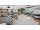 Bright living room boasts sleek hardwood floors, modern furnishings, and a wall of sliding glass doors at 110 W Missouri Ave # 18, Phoenix, AZ 85013