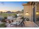 Backyard patio with lounge chairs, mountain views, and a waterfall feature at 11462 E Kora Way, Scottsdale, AZ 85255