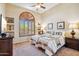 This room features natural light, two twin beds, and custom window shutters at 11462 E Kora Way, Scottsdale, AZ 85255