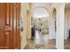 Elegant foyer featuring arched doorways, slate floors, and an open floorplan at 11462 E Kora Way, Scottsdale, AZ 85255