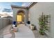 Inviting front entryway with decorative pots and unique glass-blocked windows at 11462 E Kora Way, Scottsdale, AZ 85255