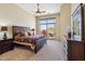 This main bedroom features a private balcony with mountain views and a beautiful ensuite at 11462 E Kora Way, Scottsdale, AZ 85255