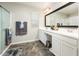 Modern bathroom features double sinks, vanity, and tiled floors at 1151 S Avoca --, Mesa, AZ 85208