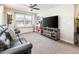 Cozy bonus room with a large window seat, comfortable sofa, and ceiling fan at 1151 S Avoca --, Mesa, AZ 85208